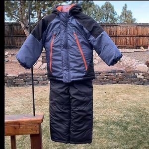 Boys matching ski-bibs and winter jacket.